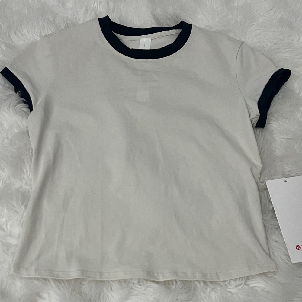 Lululemon Organic Cotton Ringer Baby Tee
Light Ivory / Black